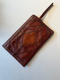 Vintage leather patchwork wristlet clutch bag.